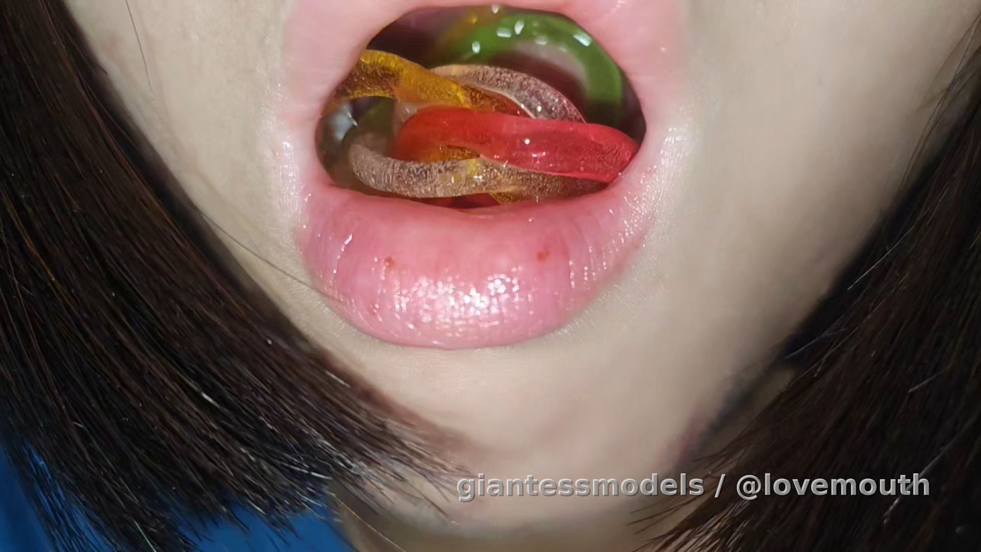 Girl swallows very long gummy candy and retches