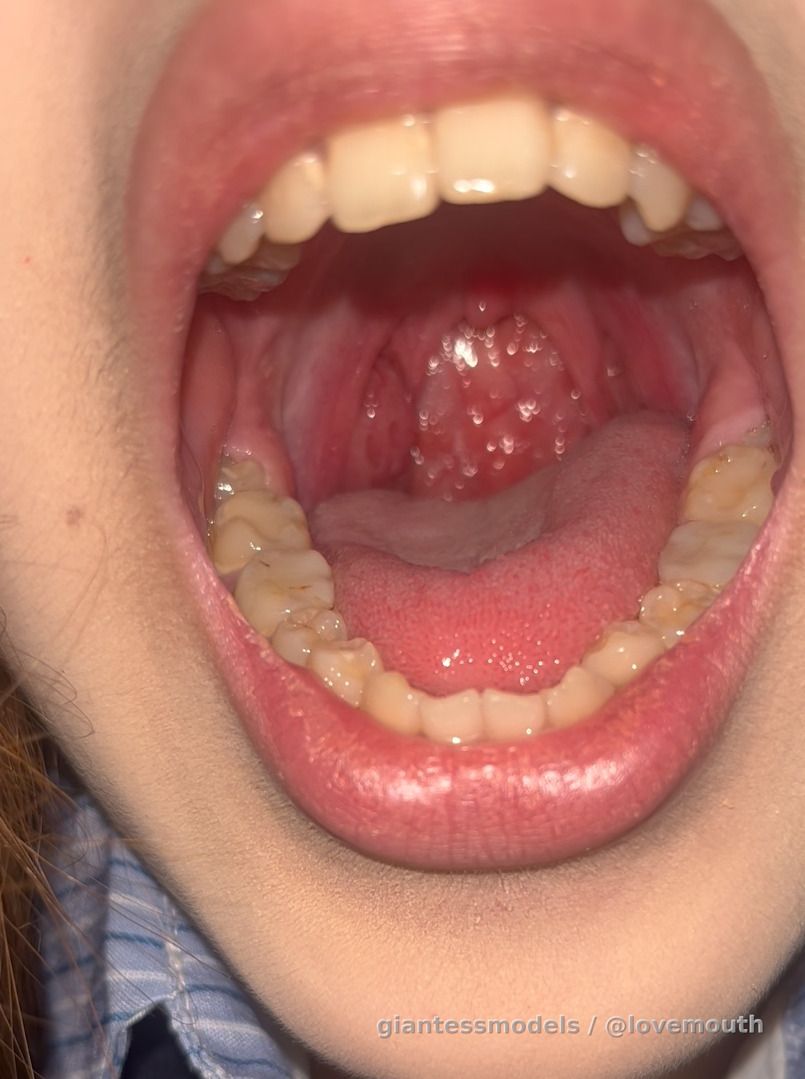 Girl checking mouth