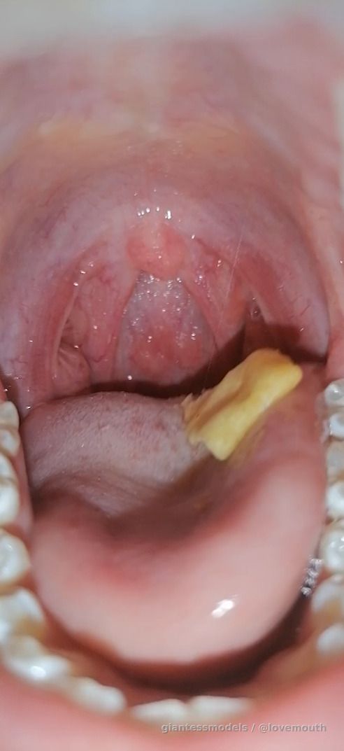 Girl shows her mouth and swallows food