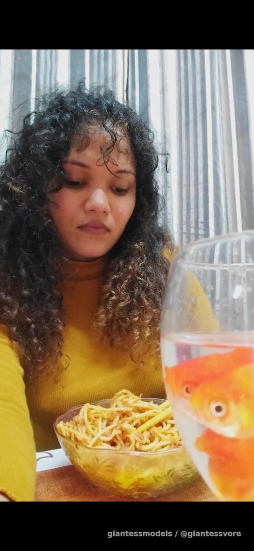 Latina girl eat food and swallow lot of goldfish 
