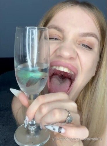 Hot Blonde Russian drinks 2 fish and dances while digesting them.