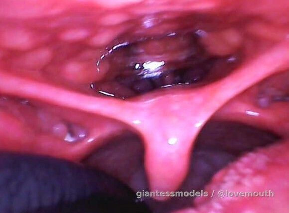 The girl examines her nasopharynx with an endoscope.