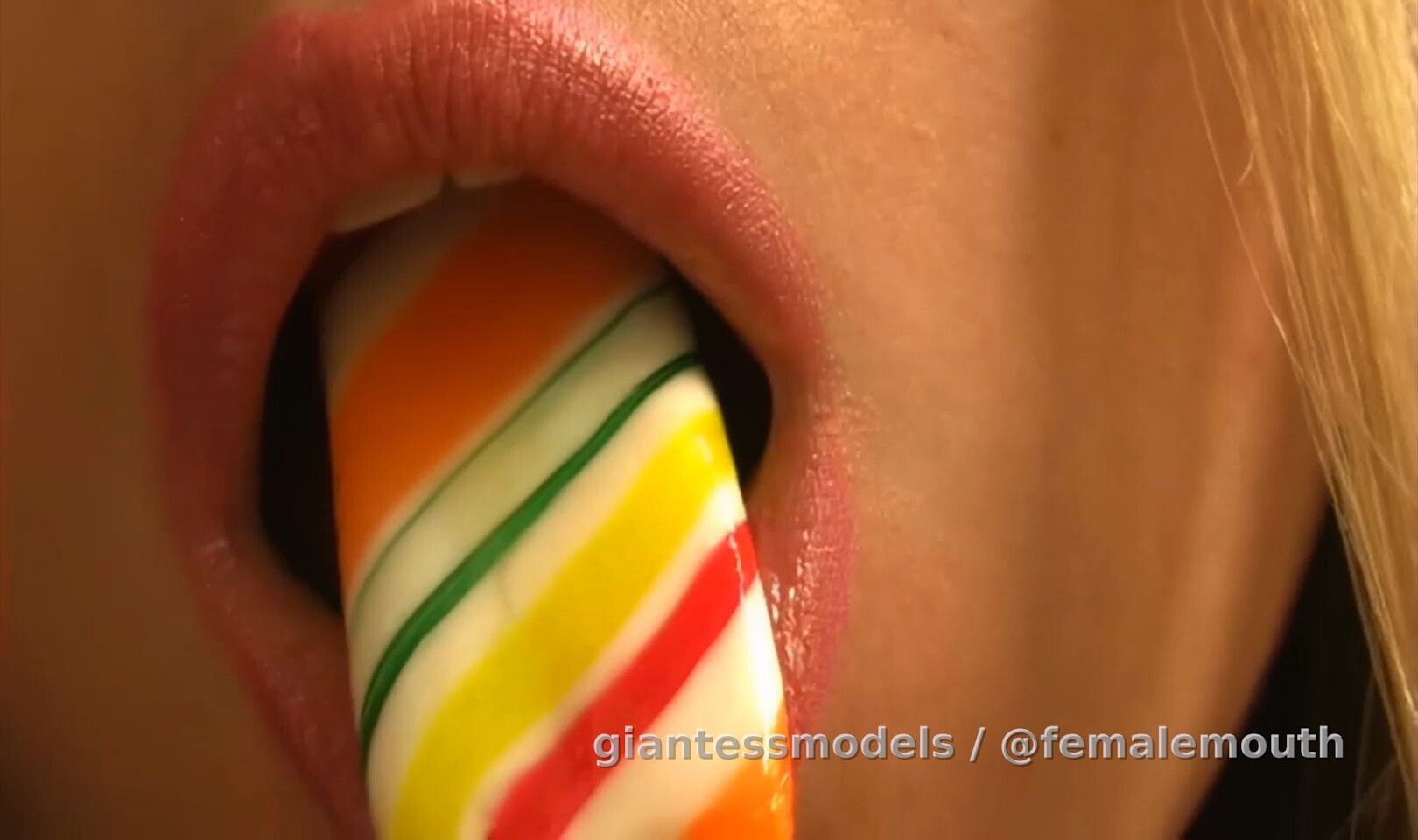 Enhanced lollipop sucking and crunching with sexy teeth!