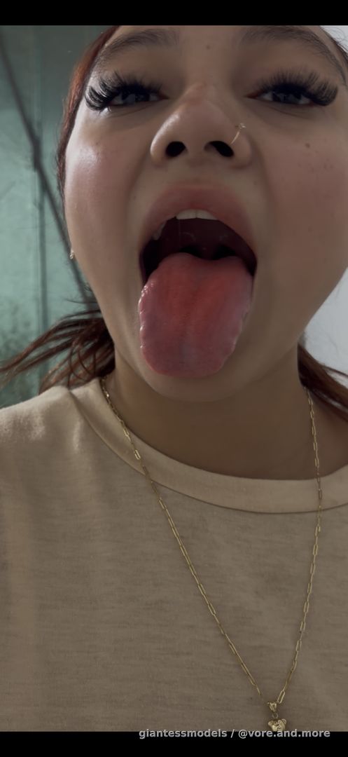 Beautiful girl swallow fish with mouth play