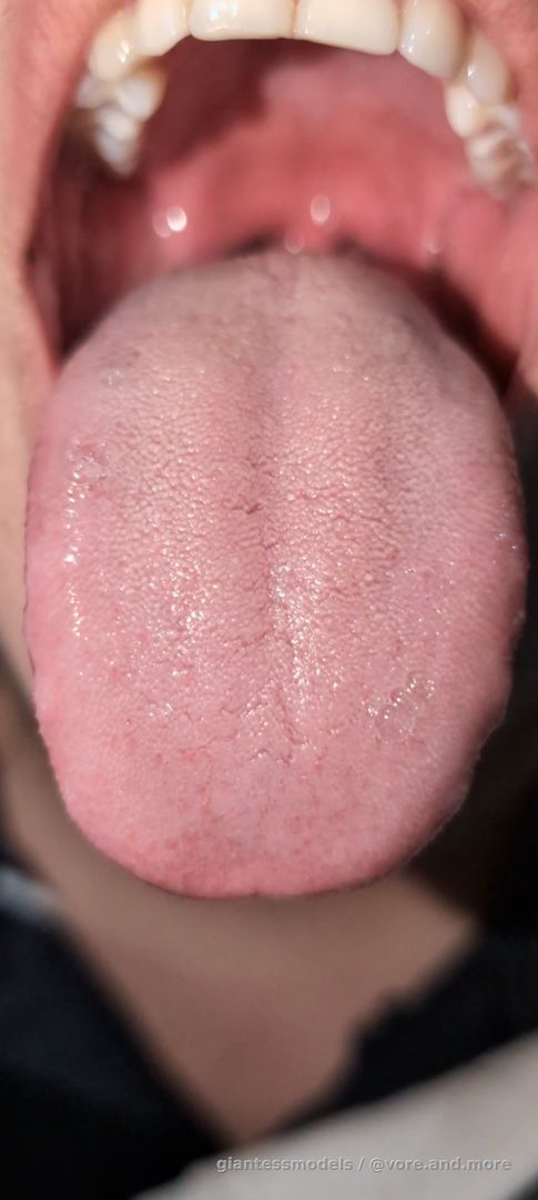 Close up long tongue fish swallow
