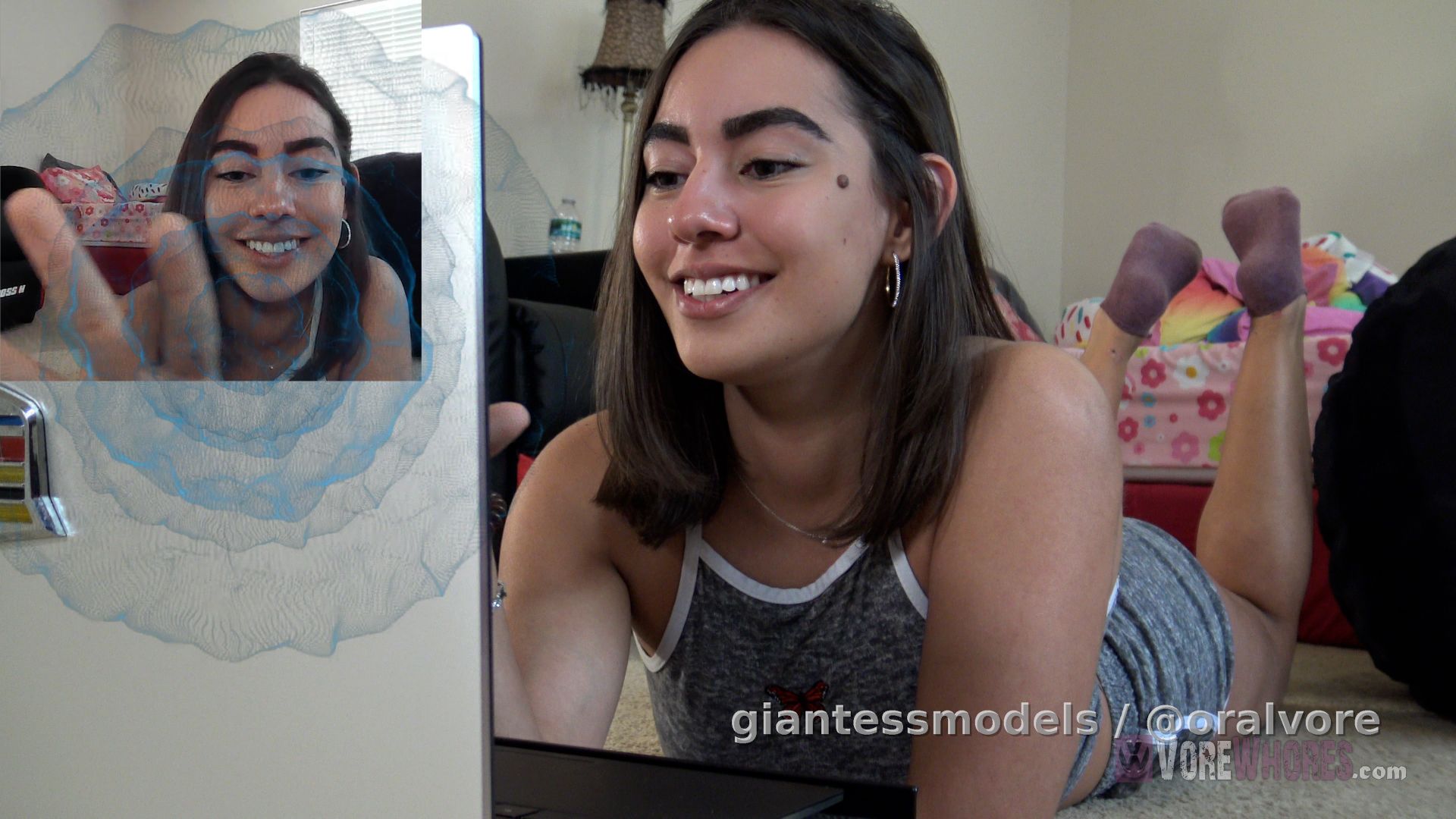 wv115 – Wink’s, Face-Time VoreGasm (Goldfish Edition) – Wink has had a hard day, and she’s hungry and horny. All Wink wants to do is masturbate, then eat. In that order. Wink opens her laptop and looks for porn that appeals to her, “Ooo, this looks interesting” says Wink as she come comes across something that obviously appeals to her, but just then, she gets a PM. “Are you kidding me? Now?” Annoyed, Wink answers the PM and discovers it’s another Vorewhores fan that found her social messaging account and decided to interrupt her day to say ‘Hi’ I’m a big fan.”

Wink talks nicely because she’s still horny and hungry, and as this dumbass has ruined her plans of masturbation and food, so they shall now become BOTH. Wink asks you if you know what her favorite sexual fantasy is, but you get it wrong and Wink snaps abruptly that her fantasy is to “EAT YOU, SILLY!”Wink wastes no time and snaps her fingers at the camera and *POOF*, the next thing you know is that Wink has transformed you, and pulled you thru her laptop screen and into her grasp.

Wink uses your tiny body to pleasure herself, then just as she’s about to cum, she tosses you into her mouth and swallows you. Wink orgasms just as you’re going down her throat. Wink relishes the feeling briefly, before going to the mirror to see if her stomach was bigger yet. Wink is definitely getting bigger, and stands in front of the mirror and shakes her tummy and butt.

Wink smiles in the mirror and notices pieces of you lodged in her teeth, so she goes to the bathroom sink to brush, brush, brush. Wink brushes her teeth and her tongue, spits in the sink and slurps up some water to rinse.

Wink exits the bathroom to lay down on her bed and take a long digestion nap. The nap scene was filmed after Wink swallowed the fish, drank a lot of water, and stood in front of the mirror shaking her belly and butt… all with the fish inside her.

BONUS – 2 xtra goldfish swallows
In the above clip, Wink pulls a fish from her laptop, masturbates with it, then swallows it as she’s orgasming. Wink is admittedly shy about any type of sex scenes, or sensual type of acting, so the scene didn’t go as well as Jim would have liked, so he asked Wink to shoot the scene again. Wink is always eager to give her best, and to give you her best, so she agreed to shoot again. Well, Jim still wasn’t happy, so they shot the scene one more time and that is what made the final production. So, Wink swallowed 3 goldfish to make this video and you’ll see them both after the credit screen.

wv114 – Wink’s, Face-Time VoreGasm (C4S Edition) – This clip was shot before wv115 and has all the same beginning video up to the transformation scene. In this clip, Wink makes the exact same clip, but with a small naked male figure. The brushing teeth scene is unique to this clip (Wink brushed 2 times for these 2 clips) and the nap scene is the same but know that the nap scene was shot after the fish was consumed.