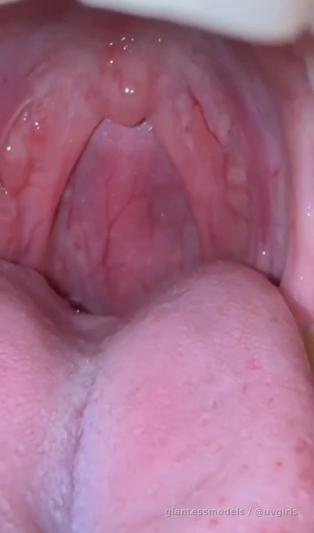 Girl shows her uvula up close