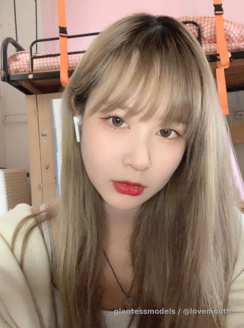 Cute blonde girl shows her mouth and retches