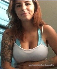 Cute Girl gulps down a litle fish.