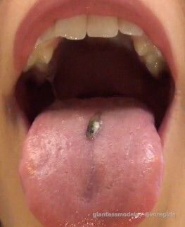 Hot Unknown Blonde Lady gulps down 2 guppys and talks nasty stuff to them.