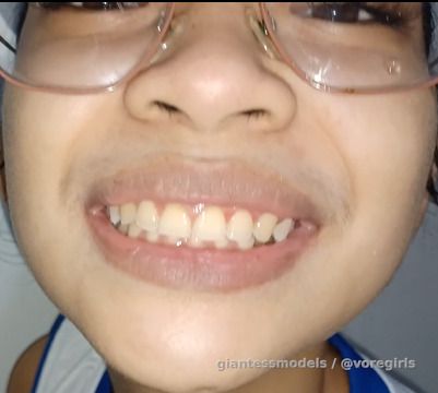 Cute Asian Girl gulps down 10 guppys with water