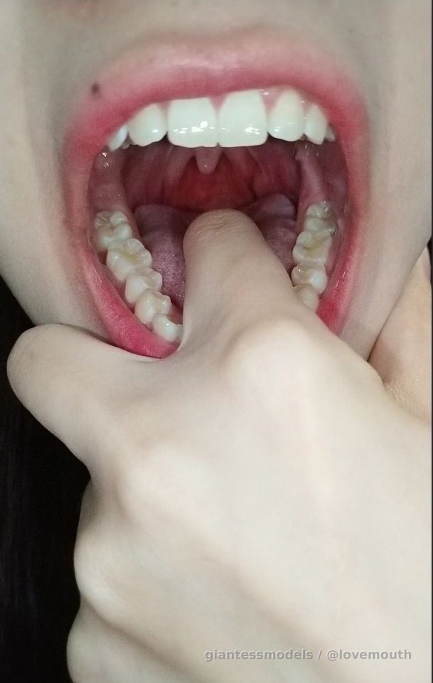 Girl plays with her mouth