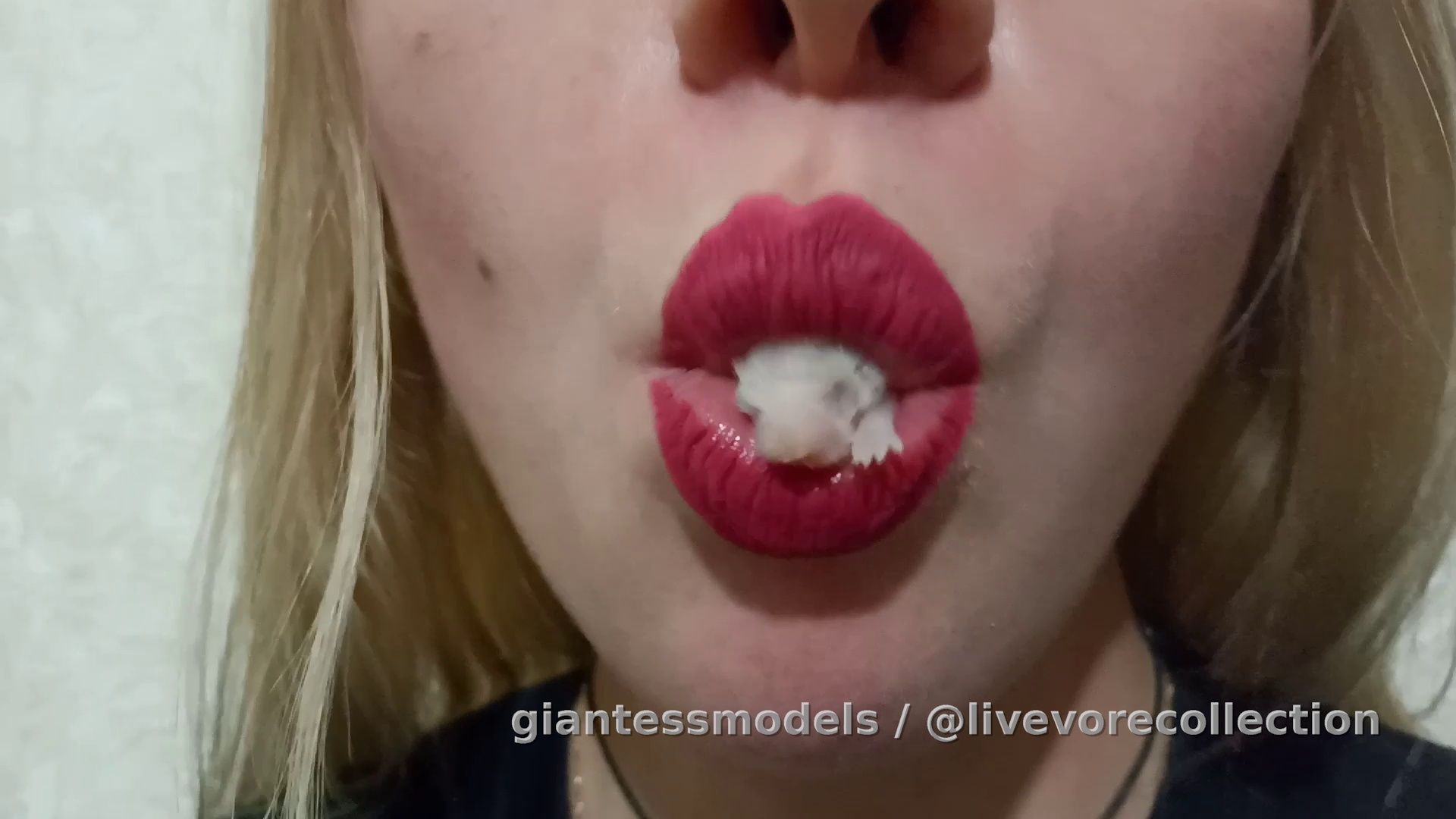 Woman plays with pinkie in her mouth