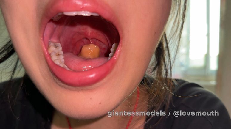 The girl swallowed a small sausage.