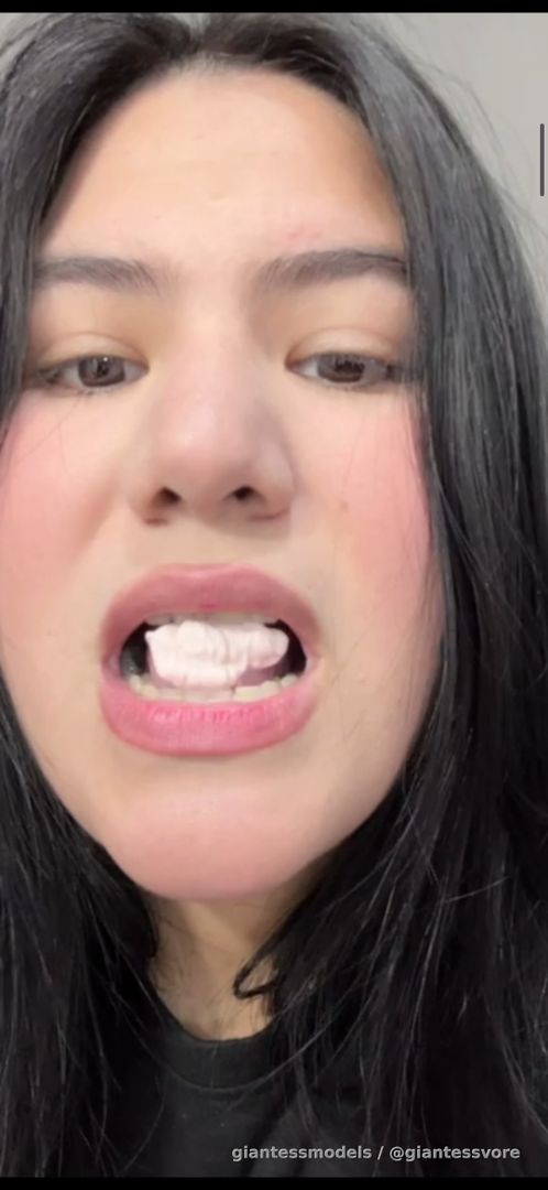 A beauty girl swallow whole a big gum