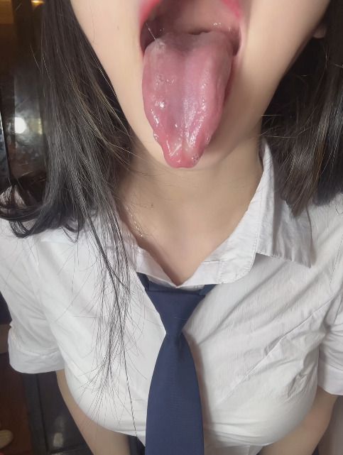 Uniform girl showing tongue and mouth