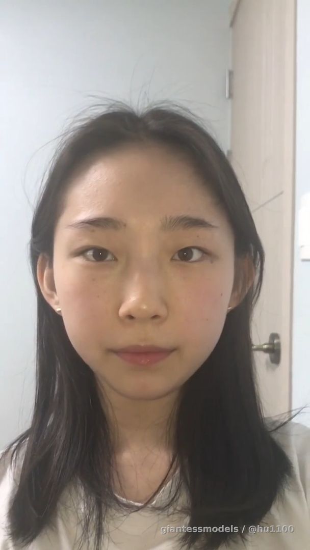A Korean girl shows the inside of her mouth in detail