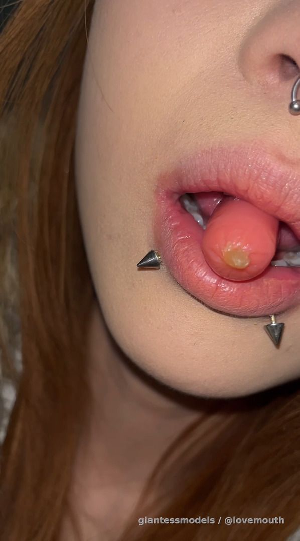 The girl swallowed the sausage and milk.
