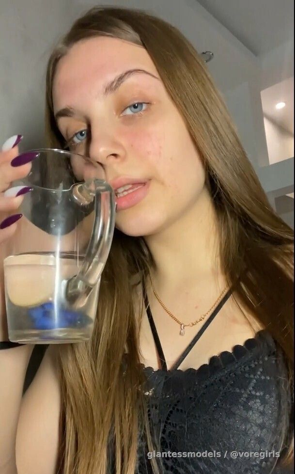 Cute Brunnette swallows a fish alive and belly dances while digesting it. 