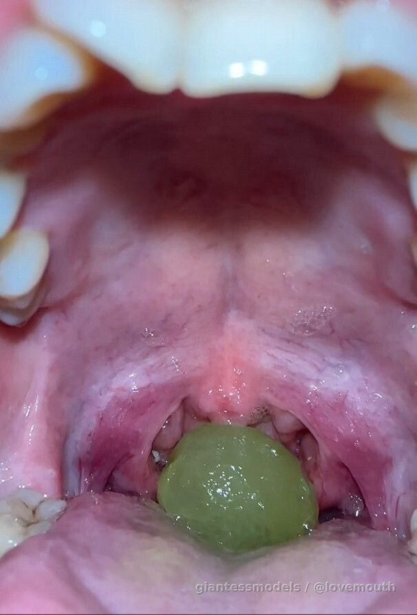 Girl swallows grapes