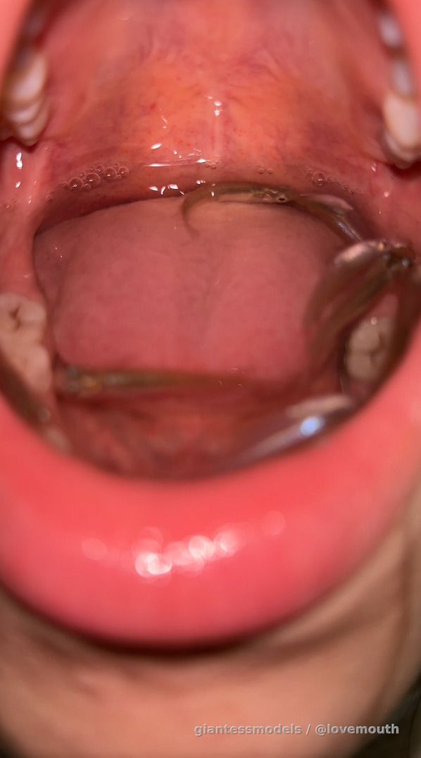 Girl swallows small fish