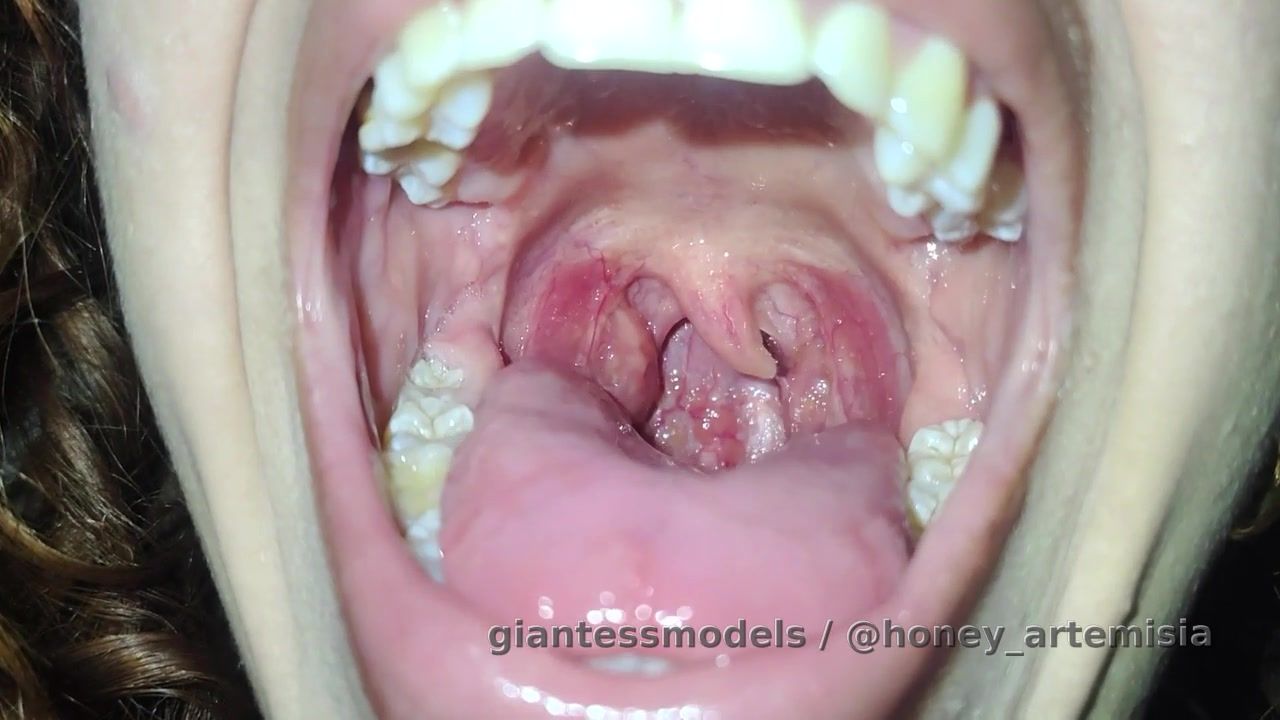 She's inside my giant mouth, begging me not to eat her! But I love her taste so much I'd never take her out of my mouth, I'd fill it with so much saliva that she'd cry for help. 