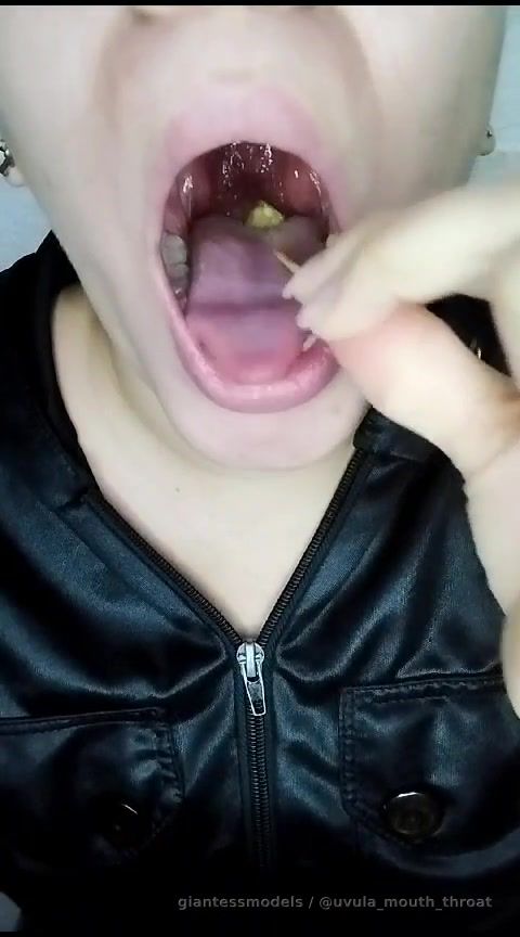 Colombian girl swallowing pineapple slices