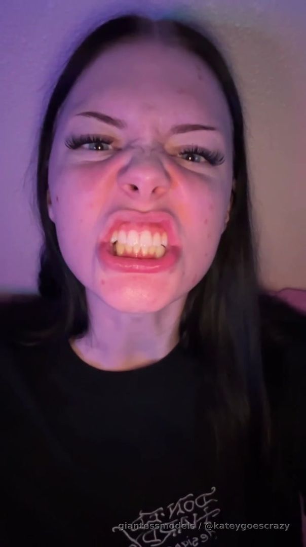 Mean giantess showing her long tongue with her angry mean gestures! 