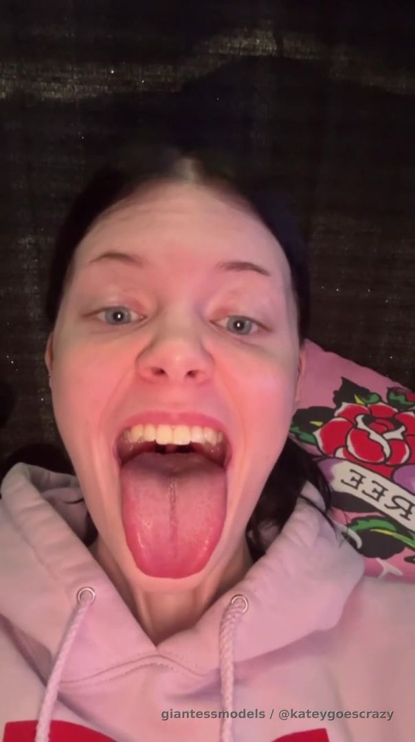 A giantess showing a mean hungry face with her tongue out to a little tiny! Terrifying!